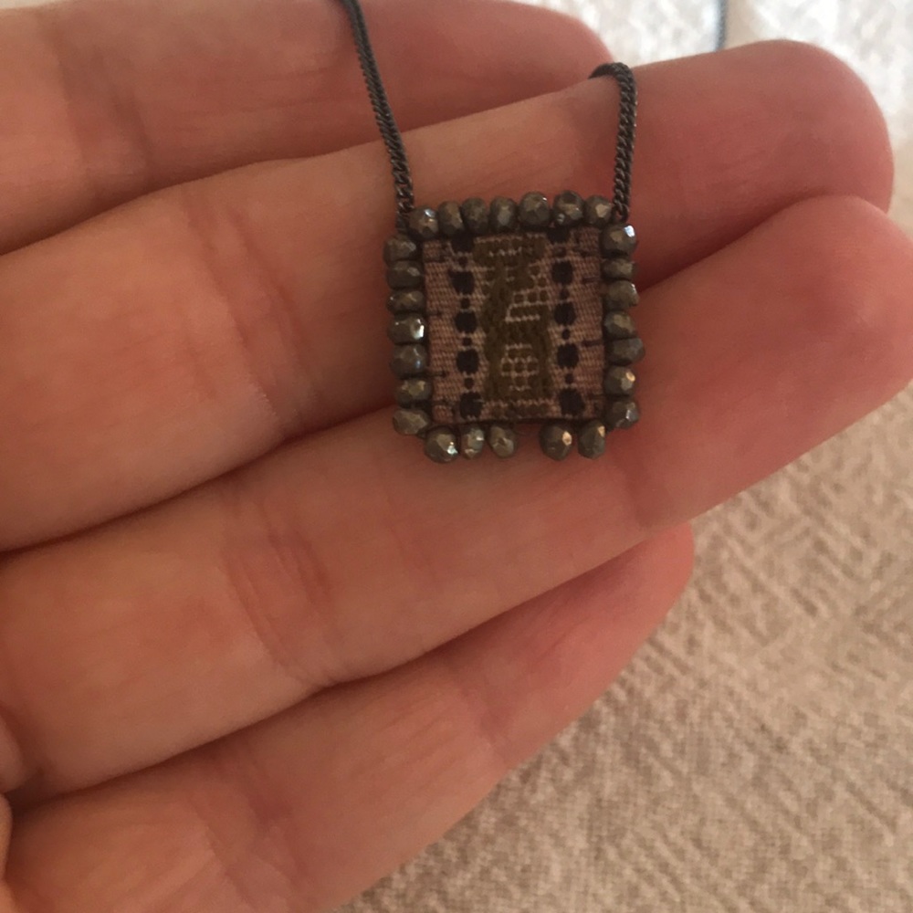 Necklace with Textil on leather pendant